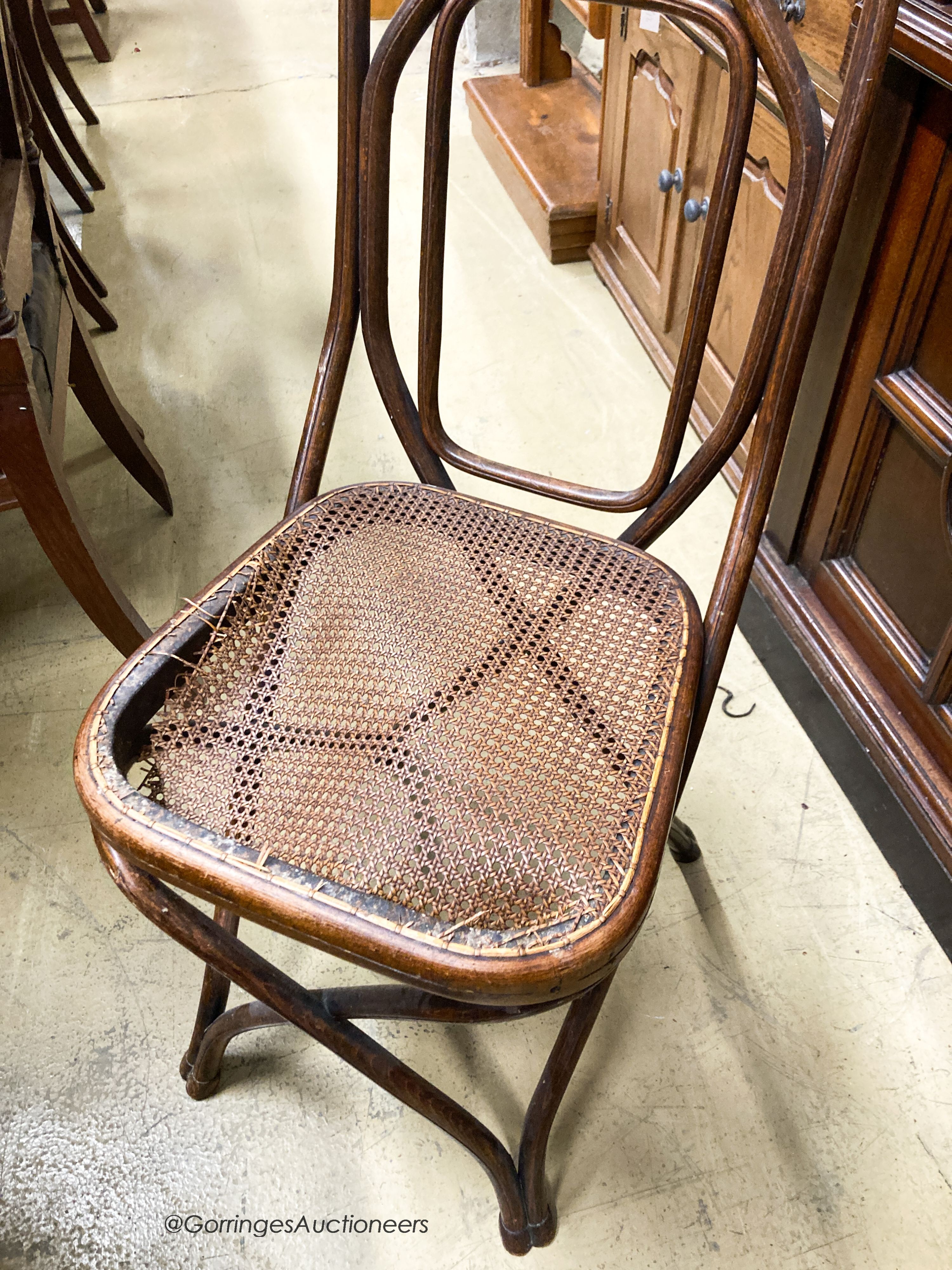 A set of five Thonet style caned beech bentwood chairs